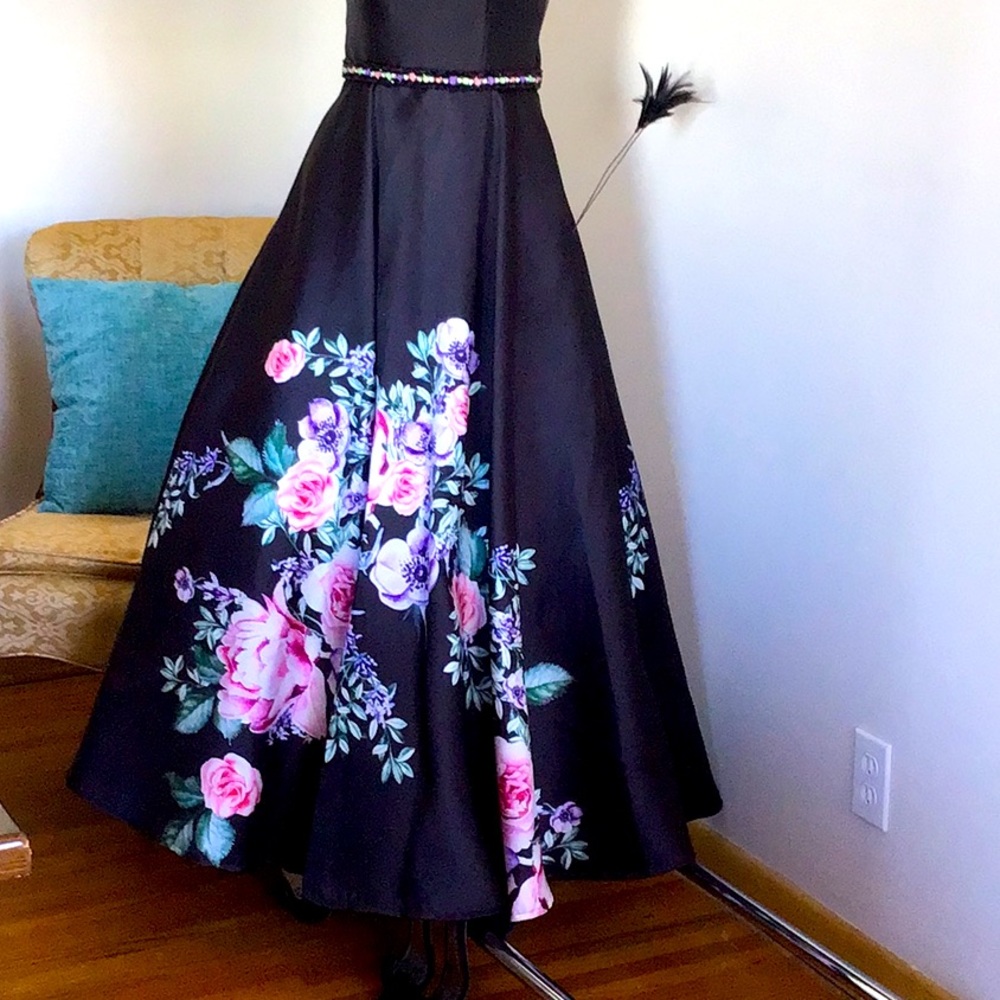 Black with flowers ballgown.